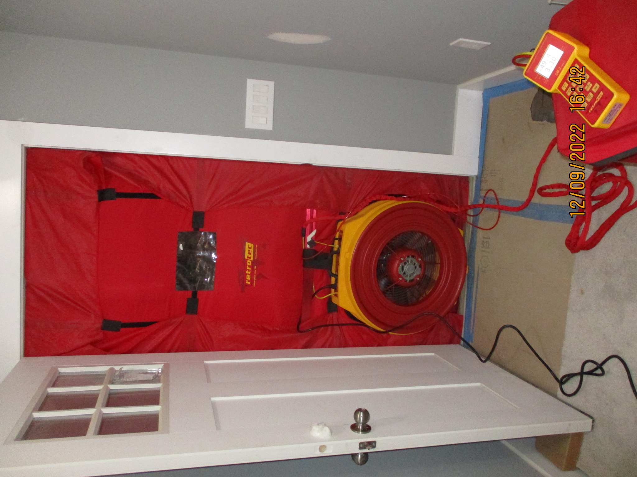 Blower Door setup in front entry door.